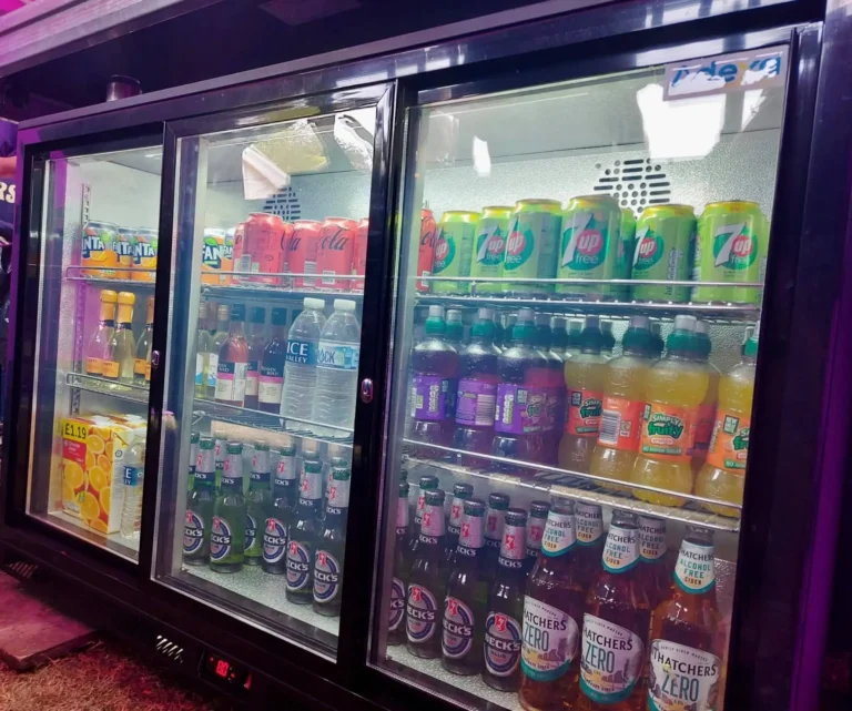 A fridge stocked with drinks.