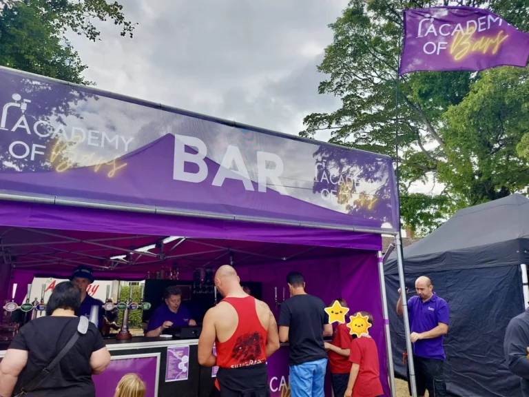 The front of the bar where people are being served.