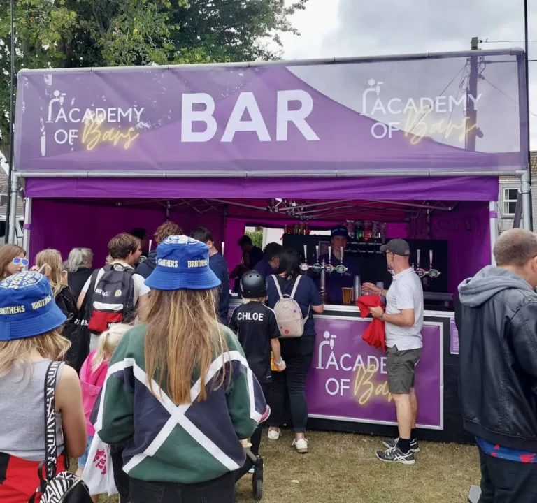 People queueing at the bar.