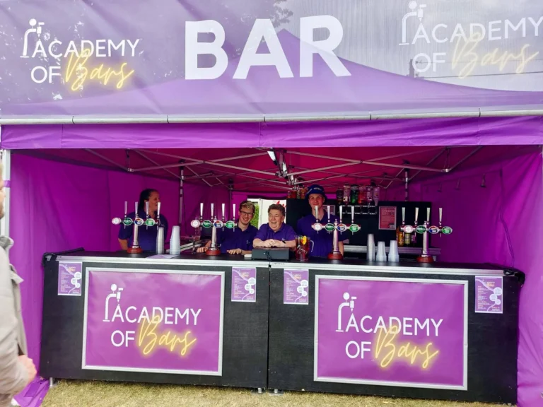 Staff standing behind the bar.