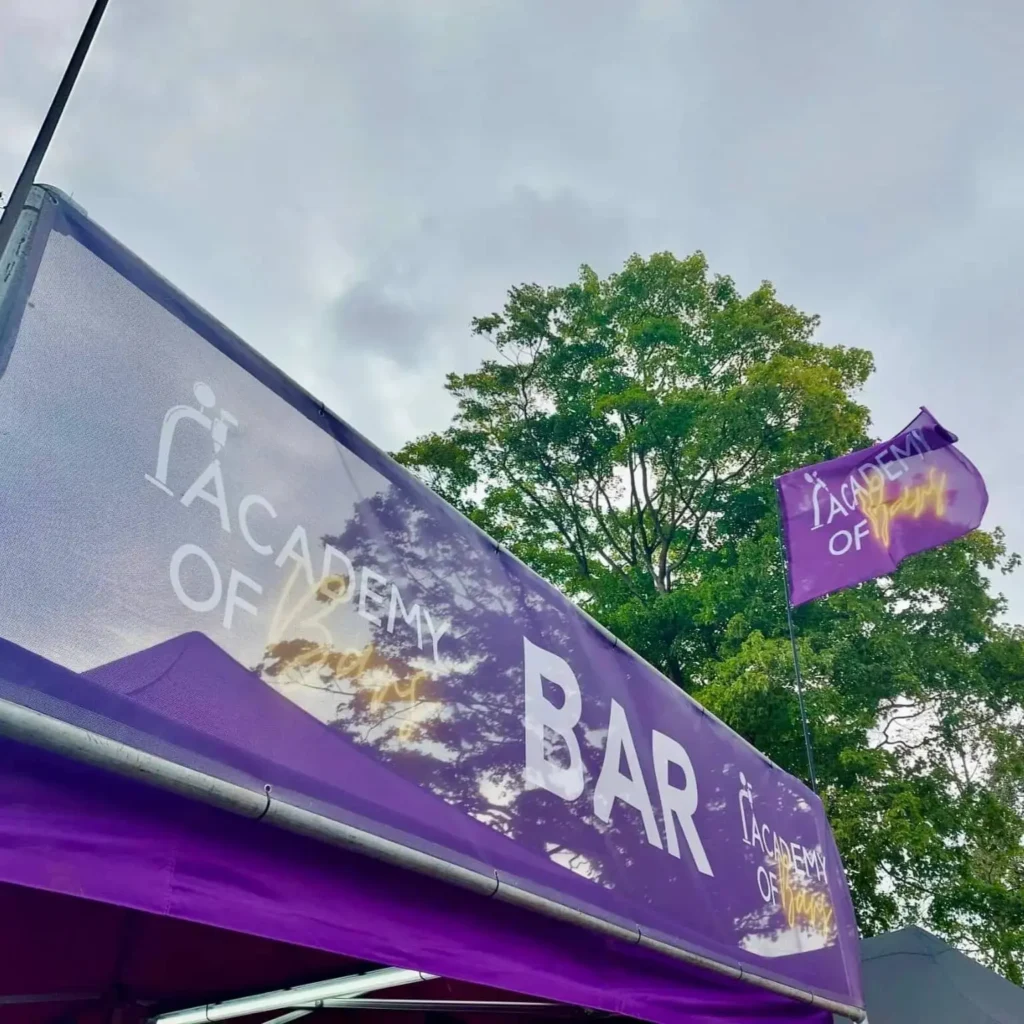 The Academy of Bars banner and flag.